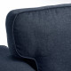 Ciemnoniebieska tapicerowana sofa rozkładana z bliska, prezentująca wysokiej jakości tkaninę i wygodny design.